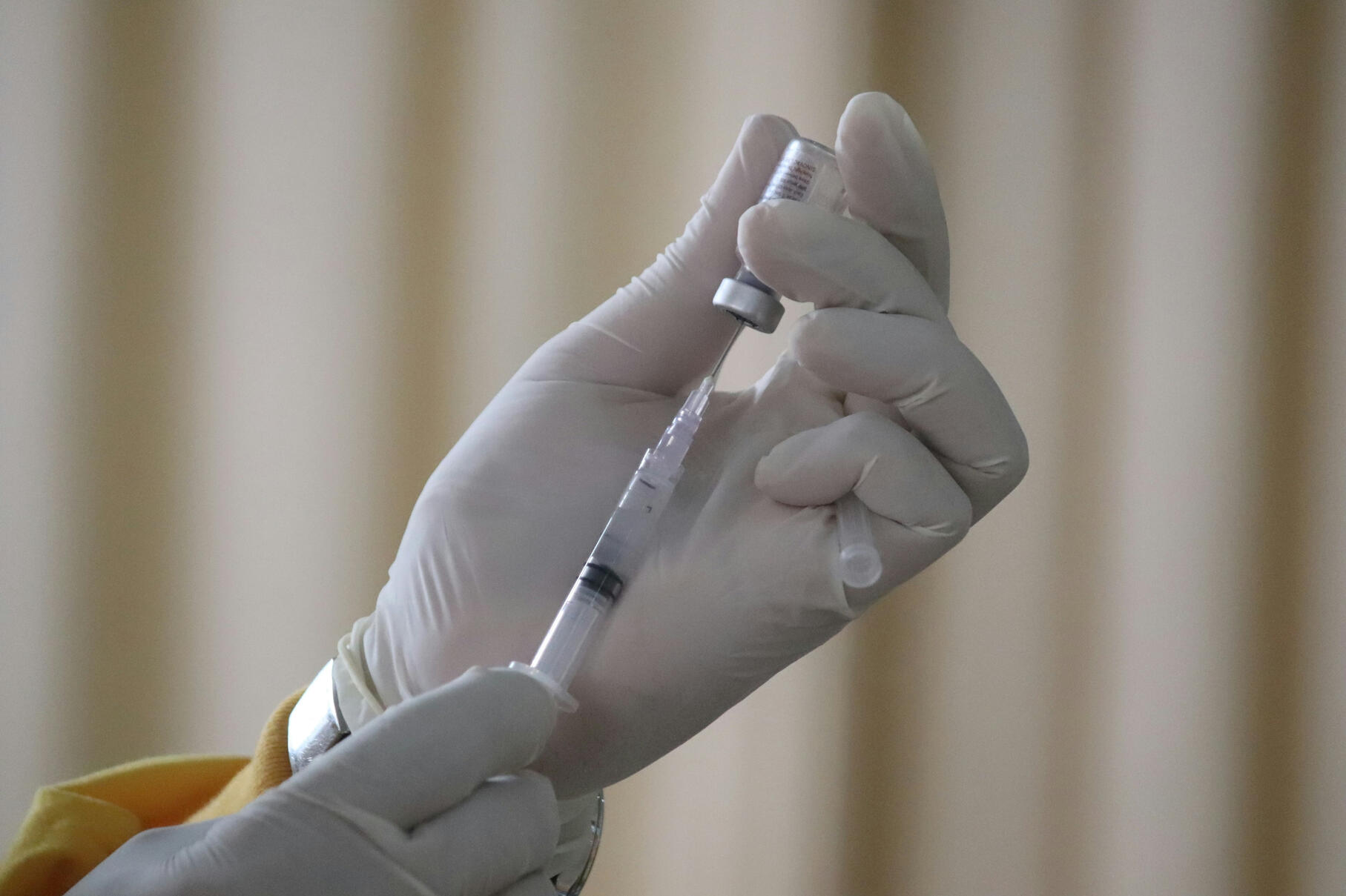 Injecting vaccine into a needle